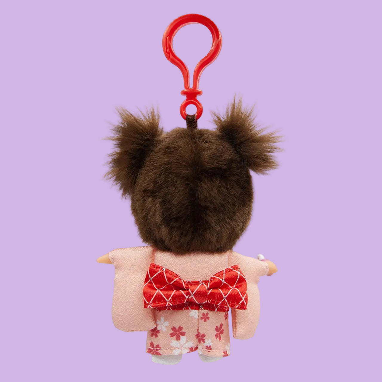 The back of a Monchhichi keychain. The figurine is wearing a kimono.