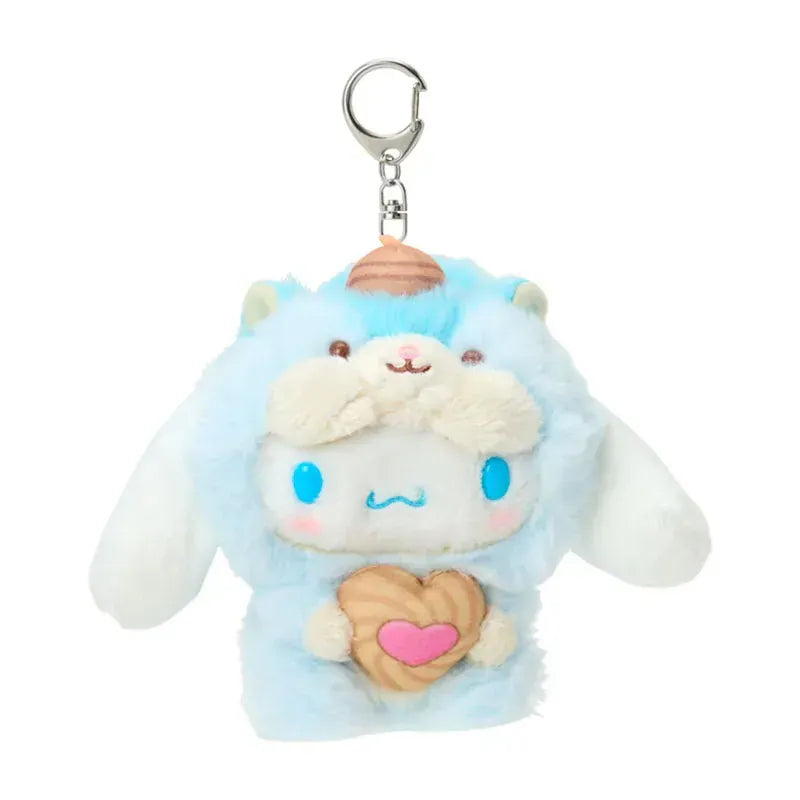 Plush keychain of Cinnamoroll puppy character in a blue squirrel outfit holding a heart-shaped nut treat. Has silver lobster clasp.