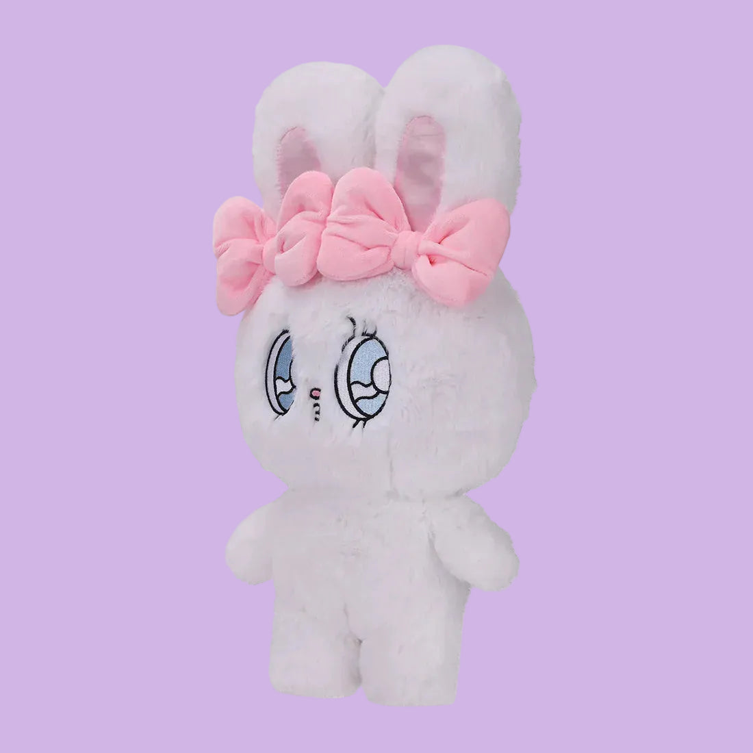 A white, fluffy rabbit plush, with big, blue eyes, and two pink bows.