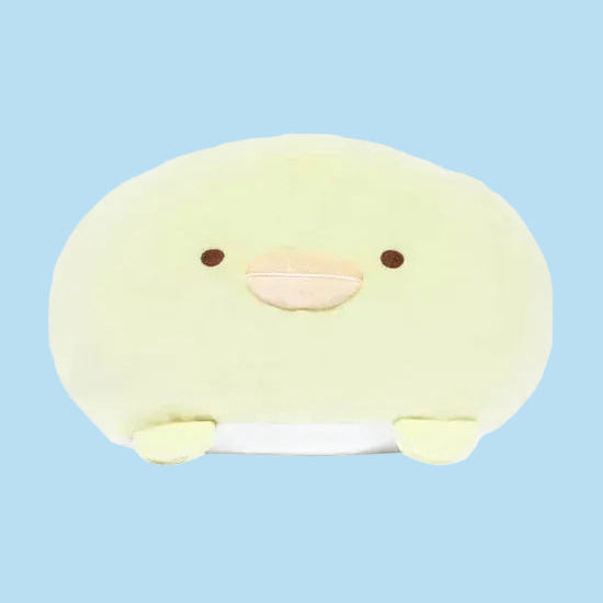 A round yellow chicken plush with a silly face.