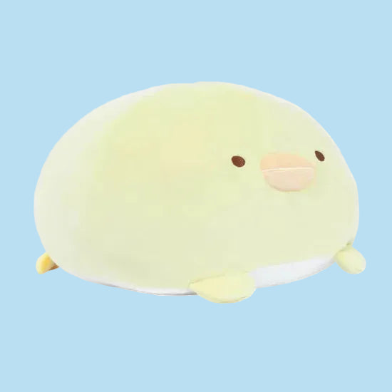 A round, yellow, chicken plush with a silly face.