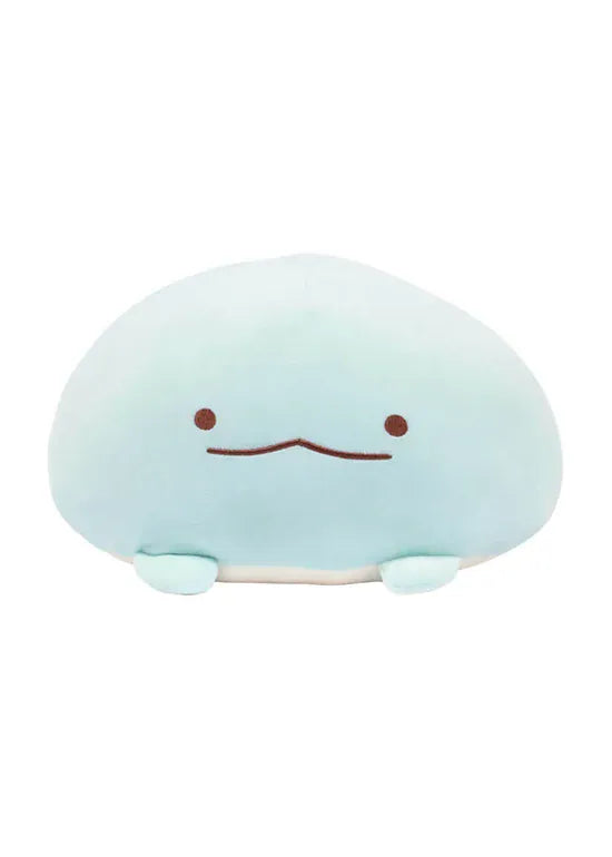 Photo of a round, blue, axolotl plush with a silly face.