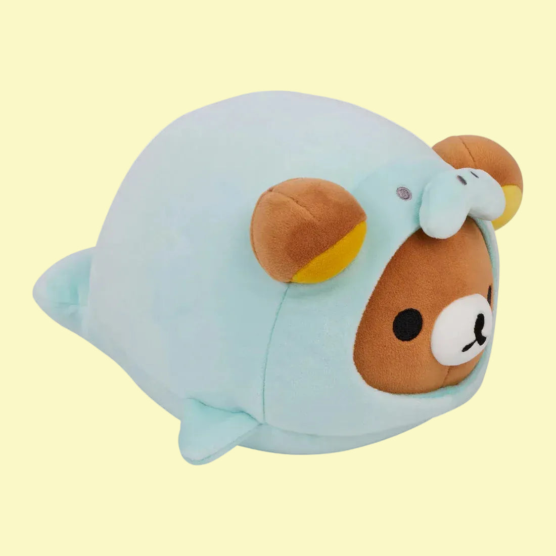 A cute, round plush of Rilakkuma wearing a seal onesie.