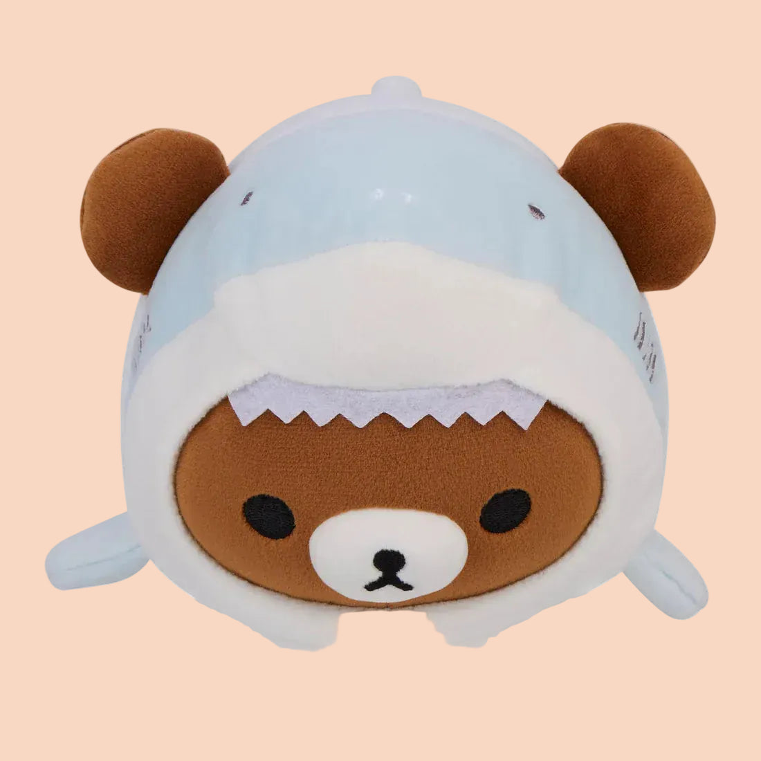 Picture of brown bear plush dressed in shark costume