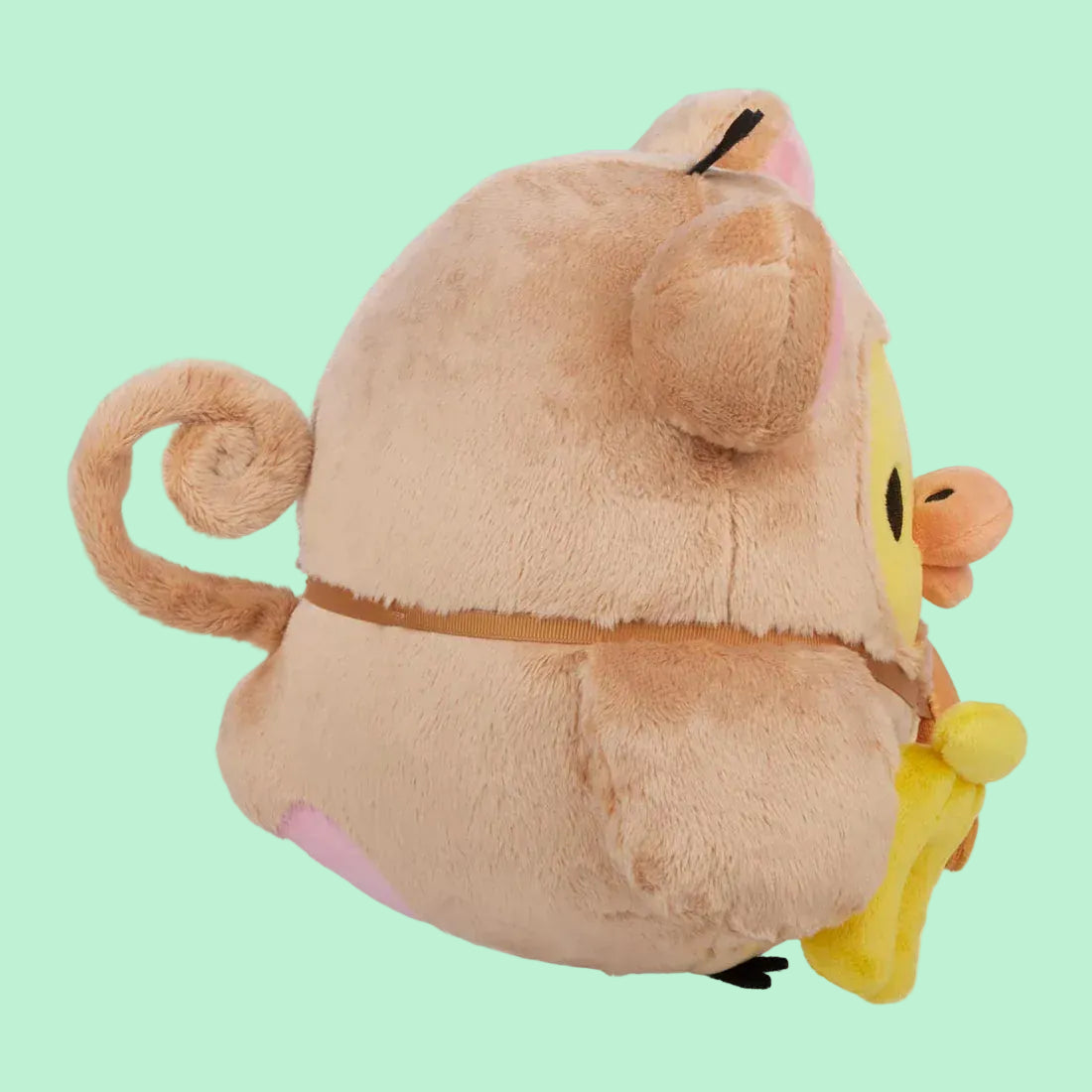 A cute plush of a rotund duckling wearing a monkey outfit.