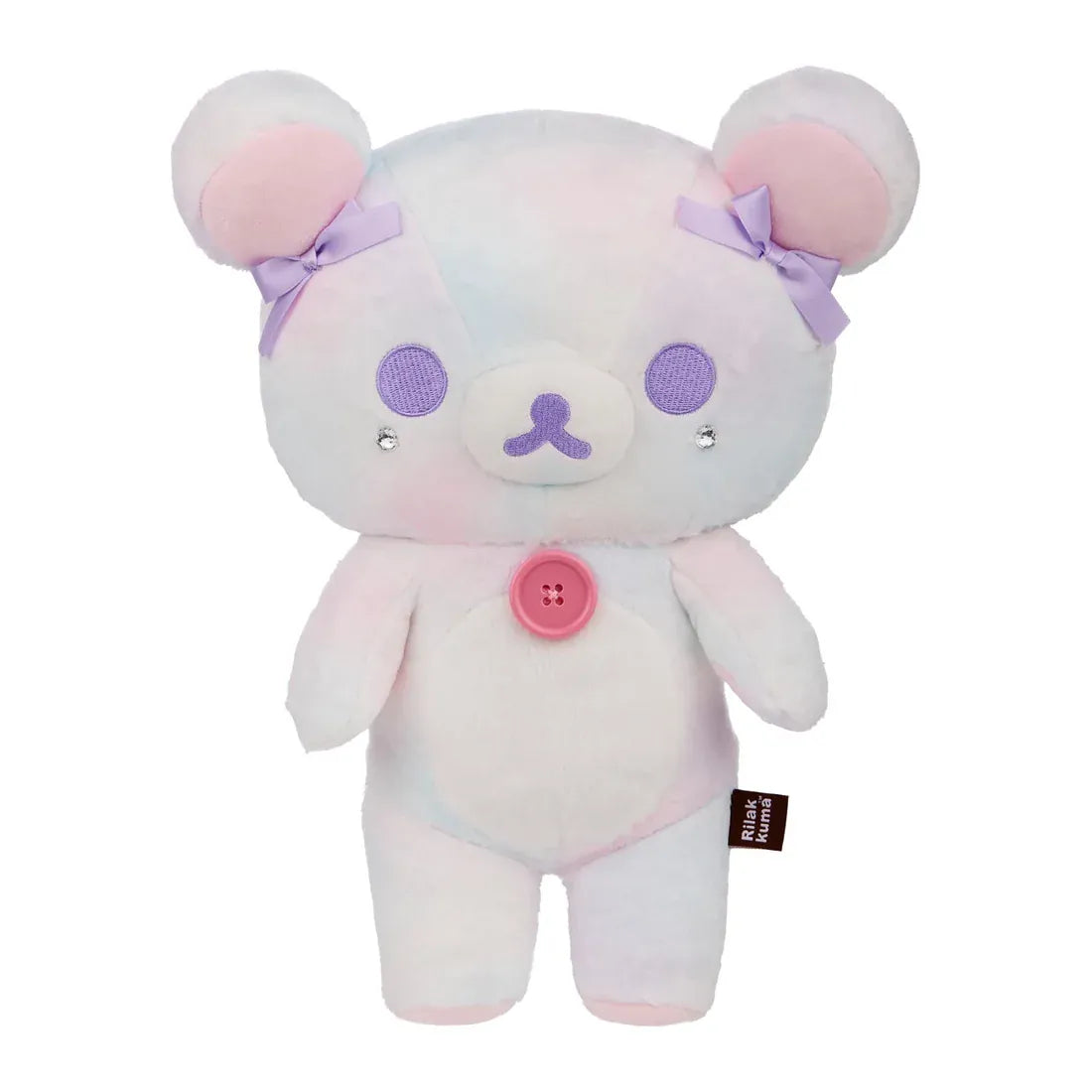 A white bear plush with purple bows on its ears and a pink button its chest.