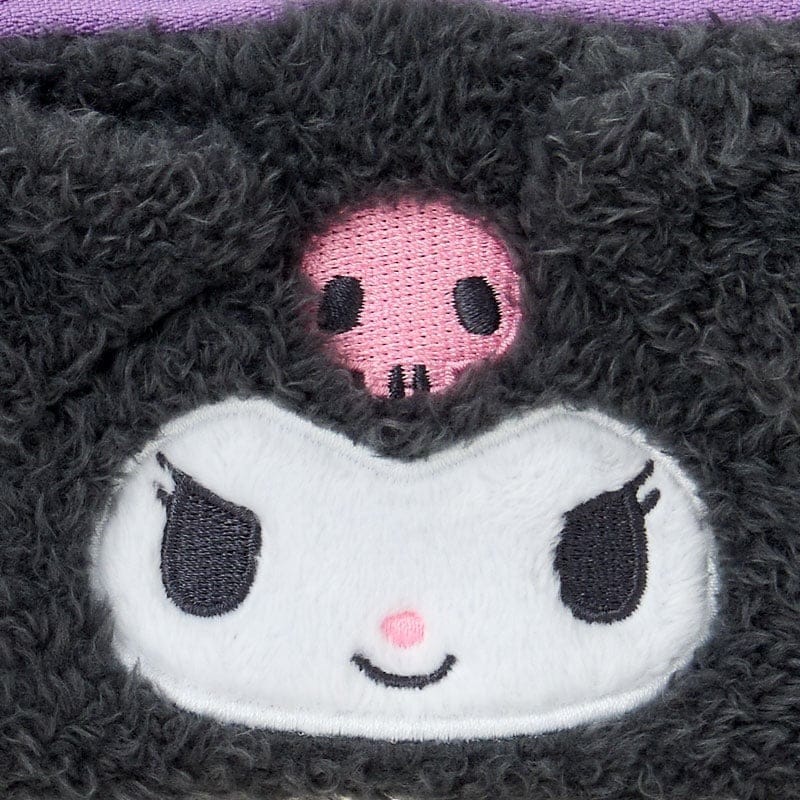 Close-up of embroidered applique character face