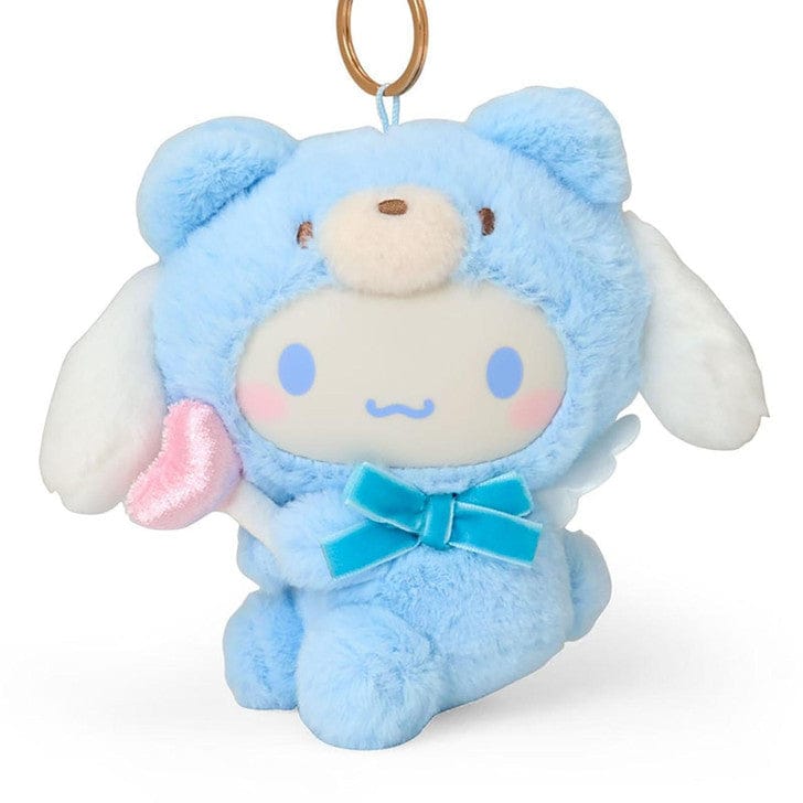 Closeup of plush Cinnamoroll in a blue bear costume with wings and a heart wand