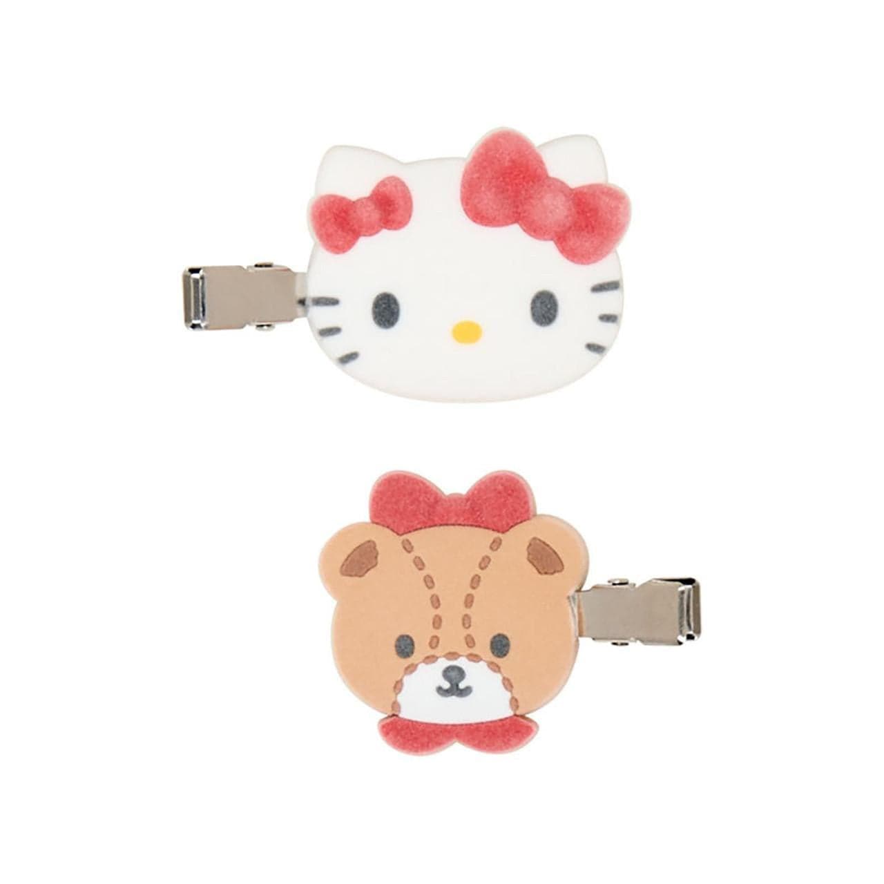 Two Sanrio character clips, one of Hello Kitty a white cat and the other a bear named Tiny Chums. Both characters have red bows.
