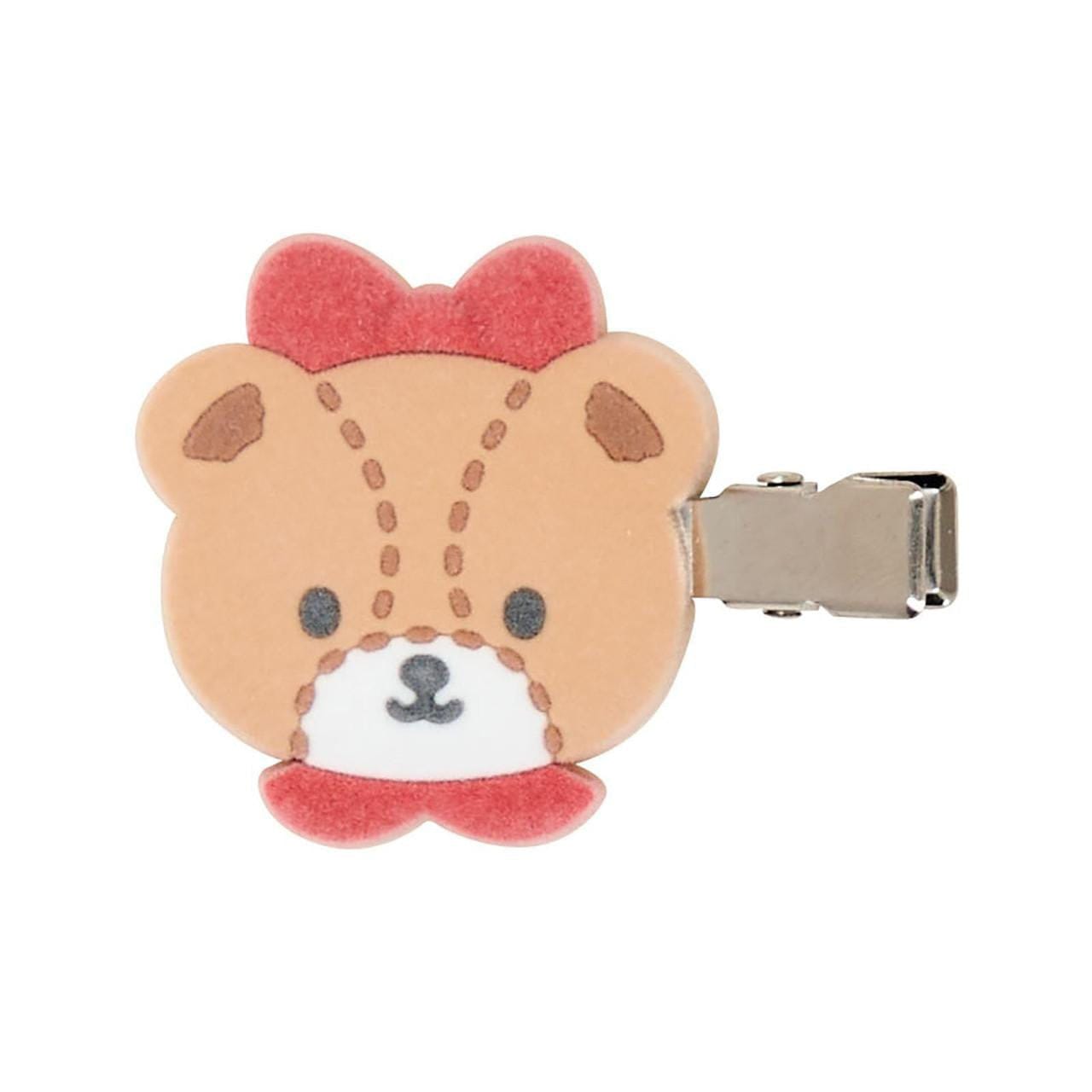 Bear face clip with a red bow on a white background