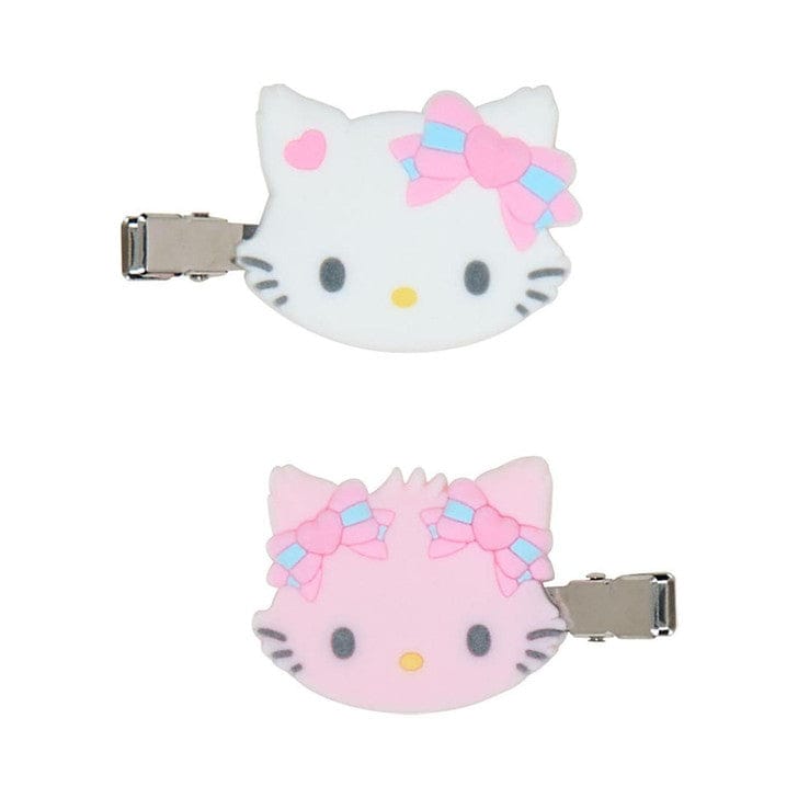 Close-up of Sanrio Charmmy Kitty and Honeycute hair clips showing flocked texture and character faces.