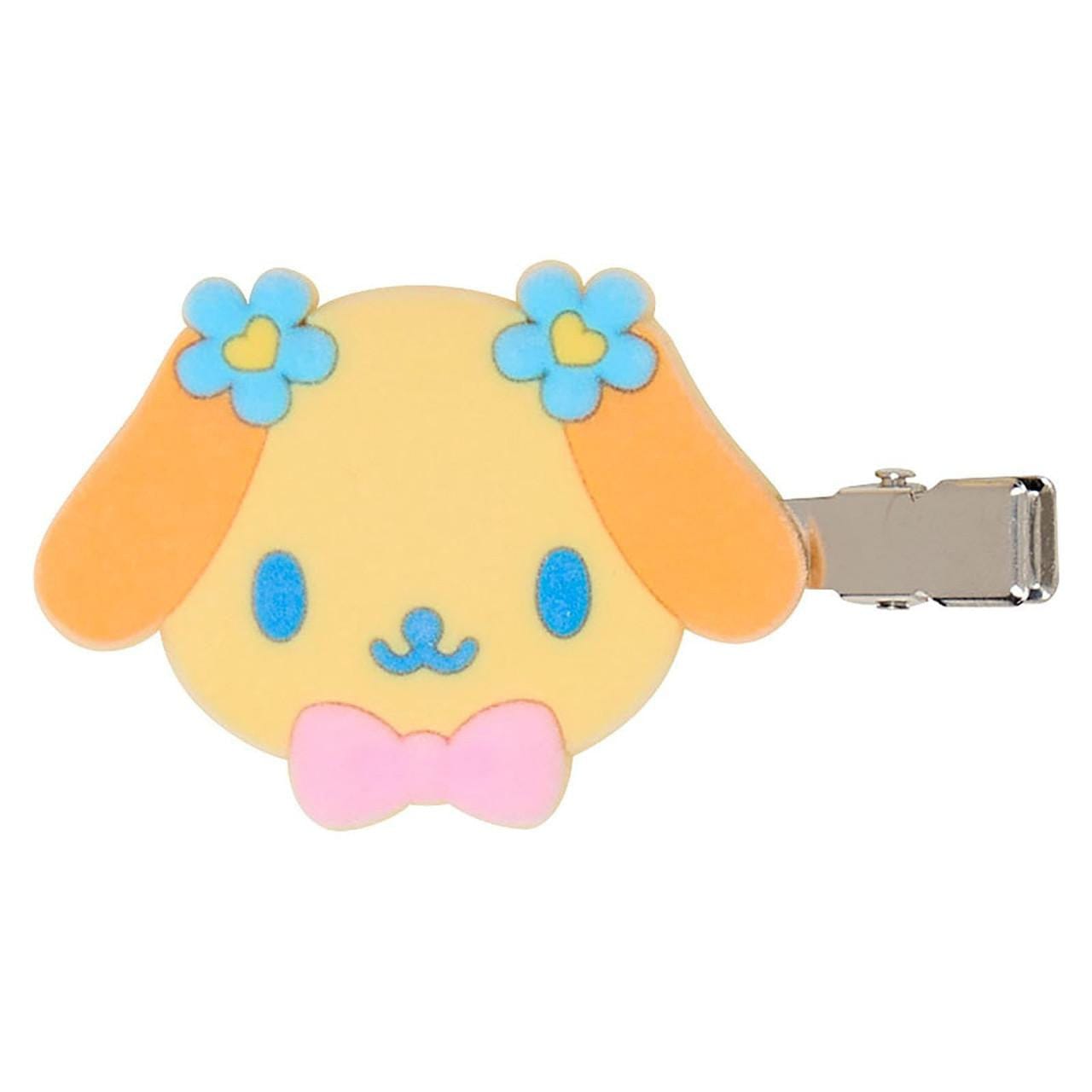 Sanrio bangs clip showing front view character face of Wanwan-chan, a caramel-colored puppy with blue flowers on each ear and a pink bowtie