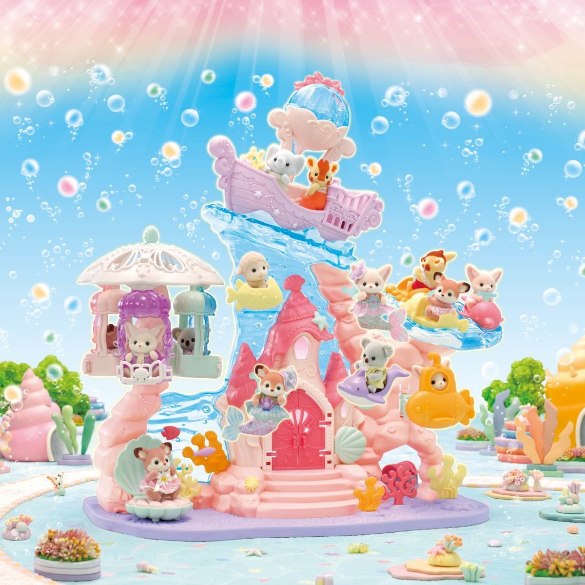 A Calico Critters mermaid castle toy. There are various animal people playing around the castle, as well as a boat riding a wave behind the castle.