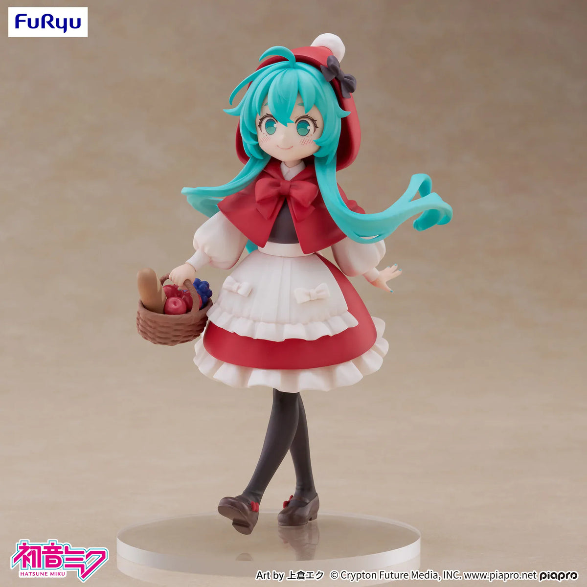 A figure of Hatsune Miku in a red riding hood outfit. She is carrying a little basket with fruit and bread.