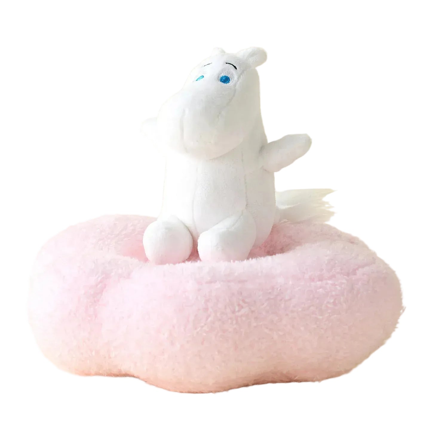 A white hippo plush sitting happily on a plush of a large pink donut.