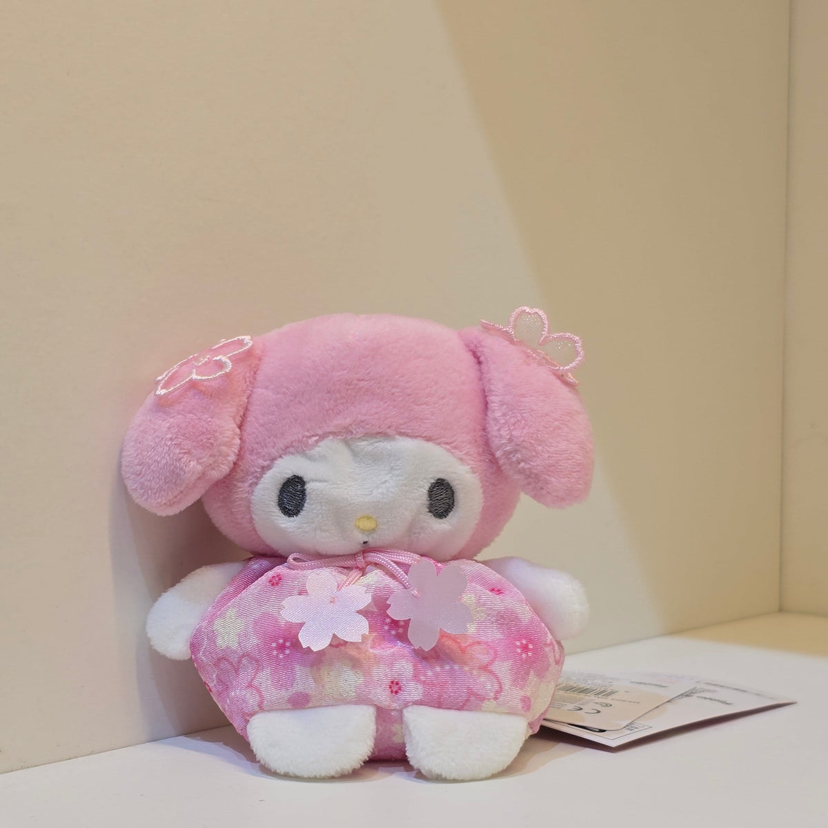 A cute My Melody plush in a pink flower outfit.