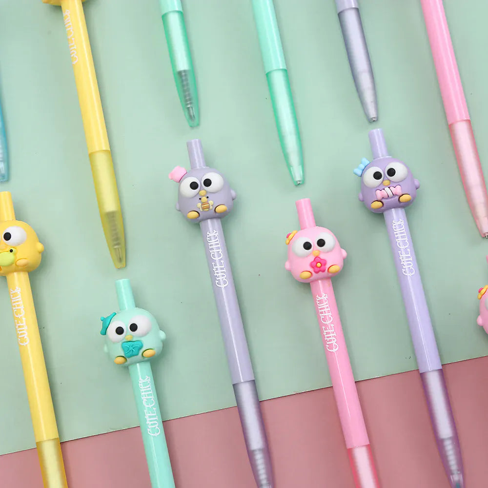 A group of many pens with little bird figures on their tops.