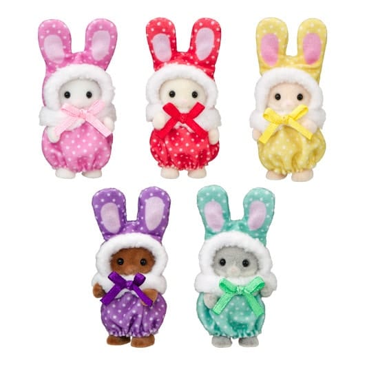 Photo of 5 flocked bunny figures in different colored polka dot outfits