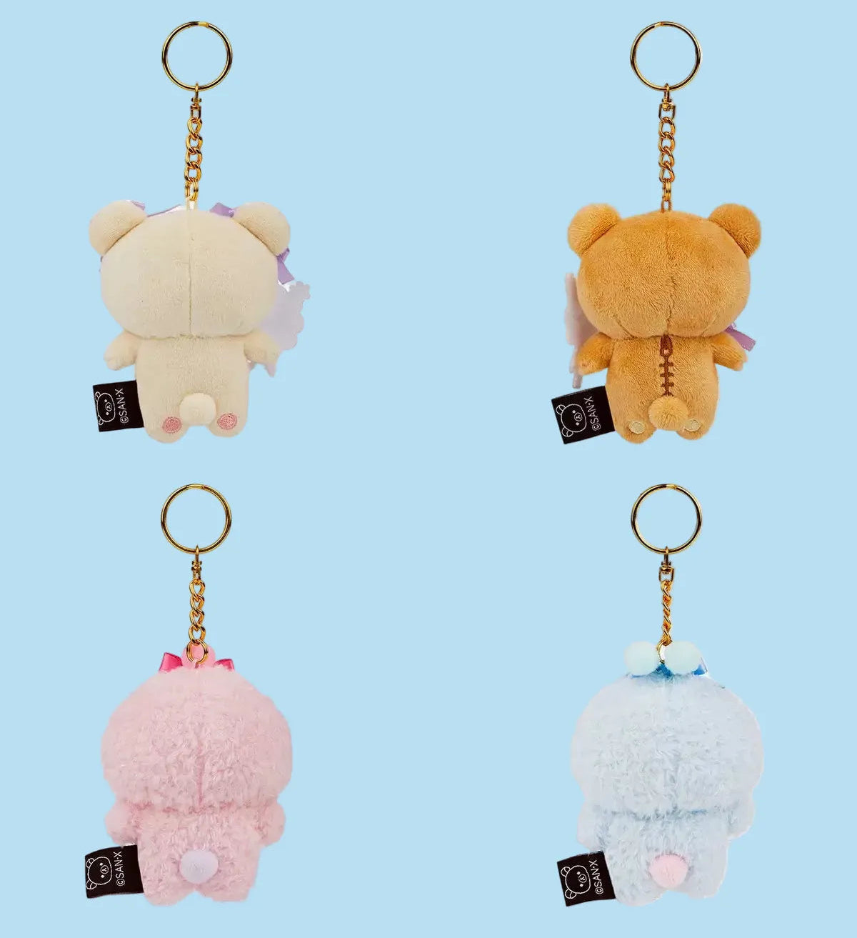Four keychains back of the designs.