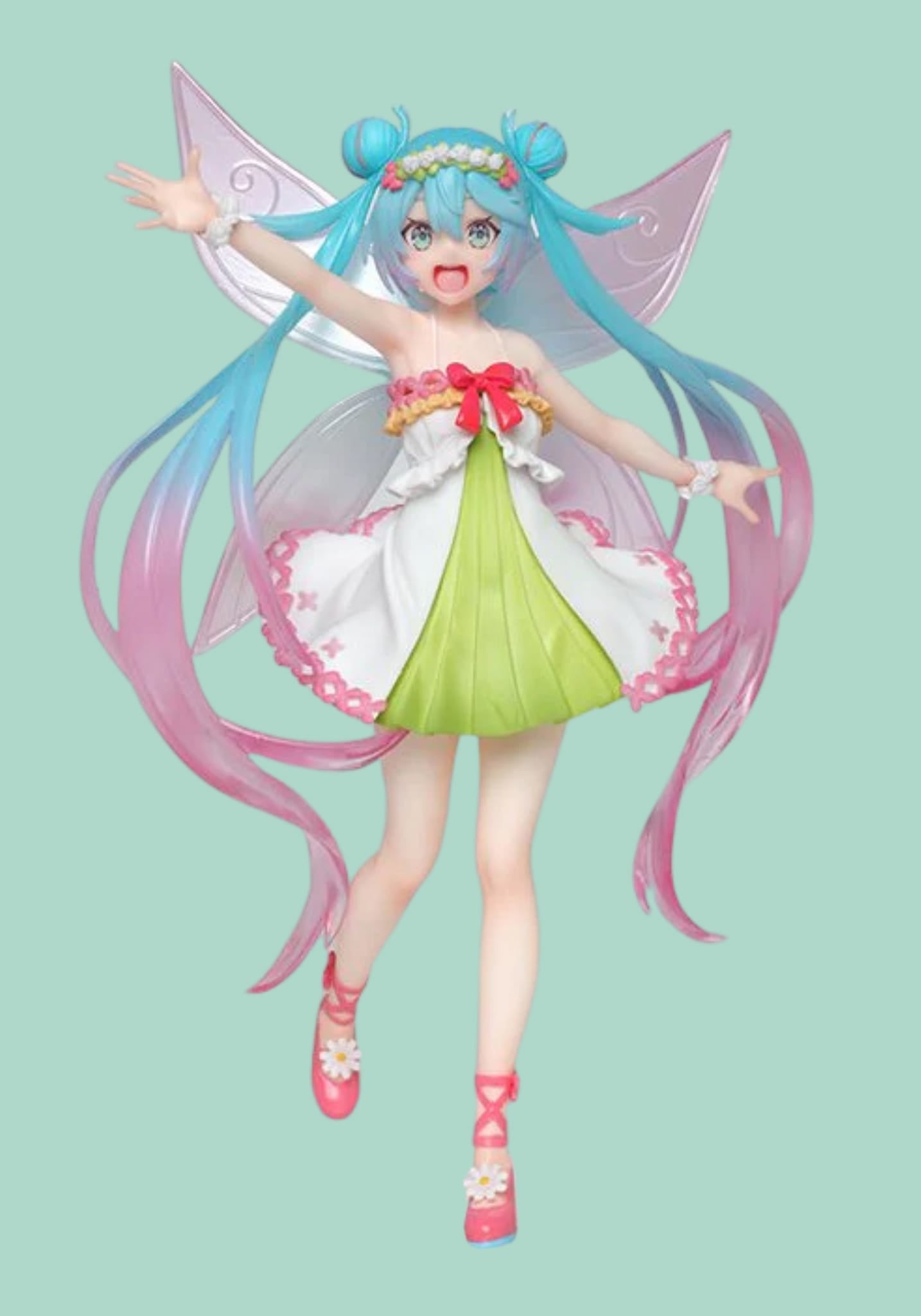 A figure of Hatsune Miku waving. She has a white and green dress and the ends of her hair are pink.