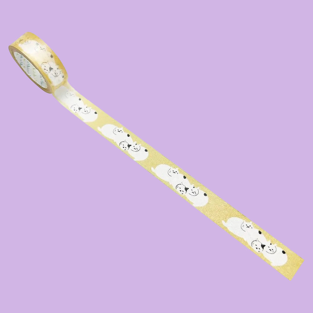 Washi tape with a repeating illustration of three cats sleeping in a pile together.