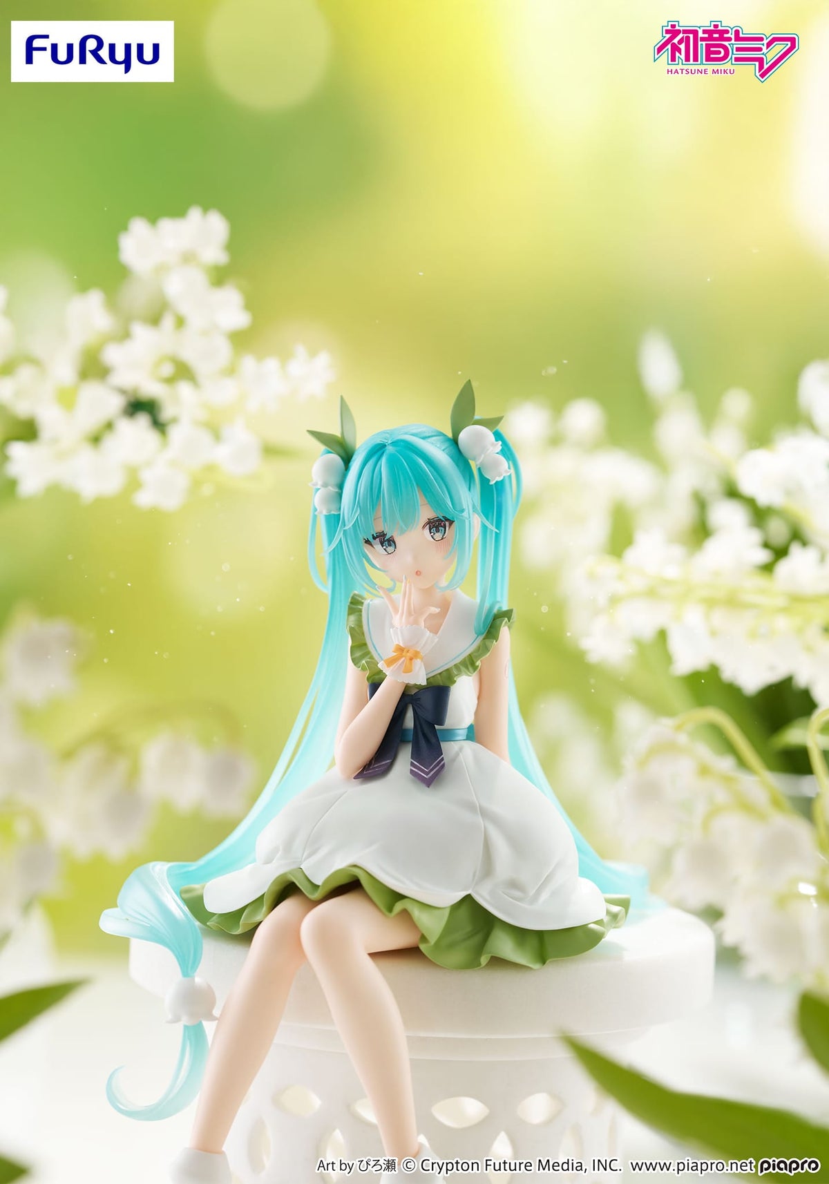 A small figure of hatsune miku sitting down. She has white flowers in her hair and is wearing a white and green dress.