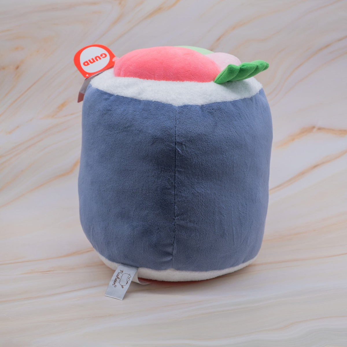 Plush of a sushi roll placed upright.