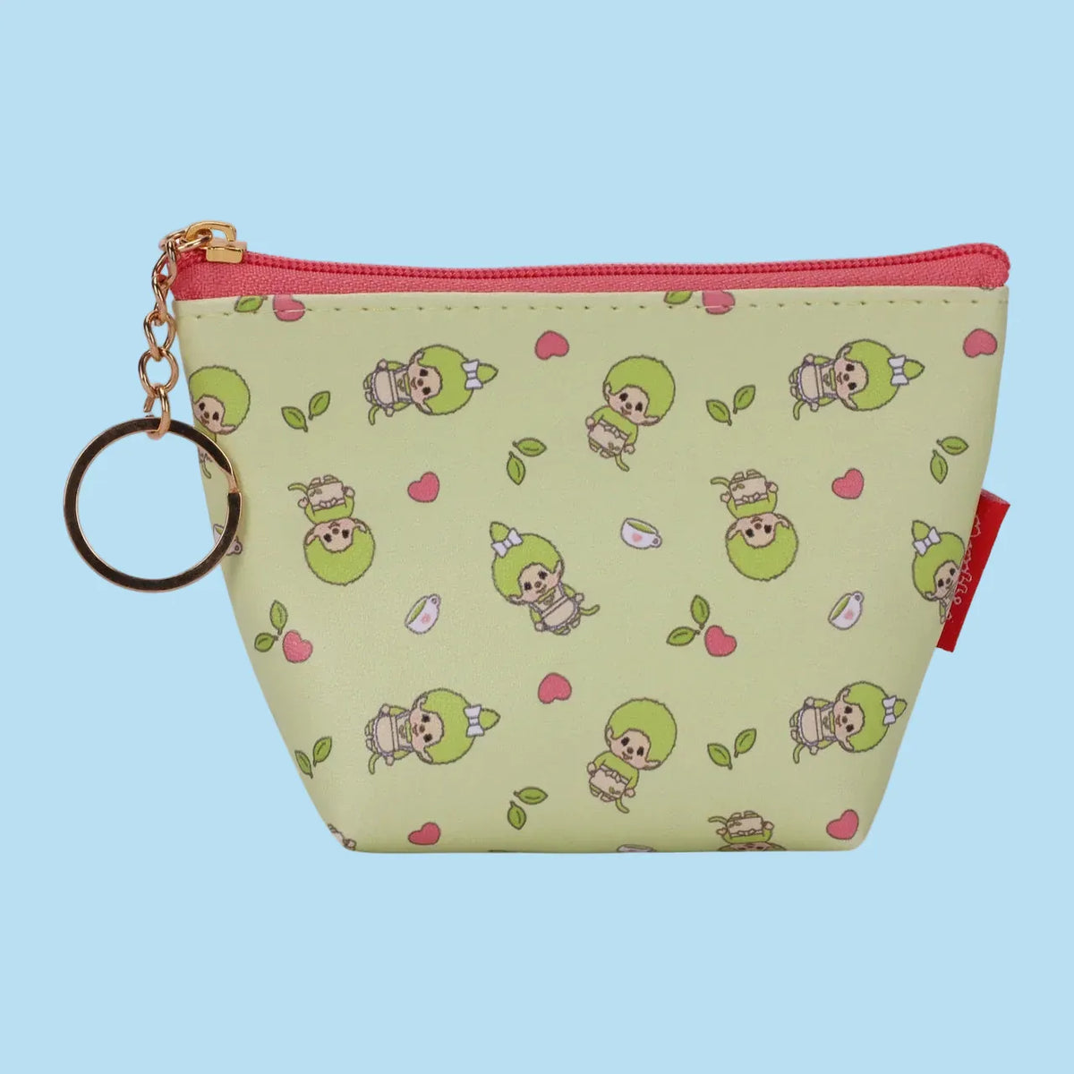 A keychain bag with zipper, it has little monchhichi motify all over, hearts, cups of tea, and tea leaves.