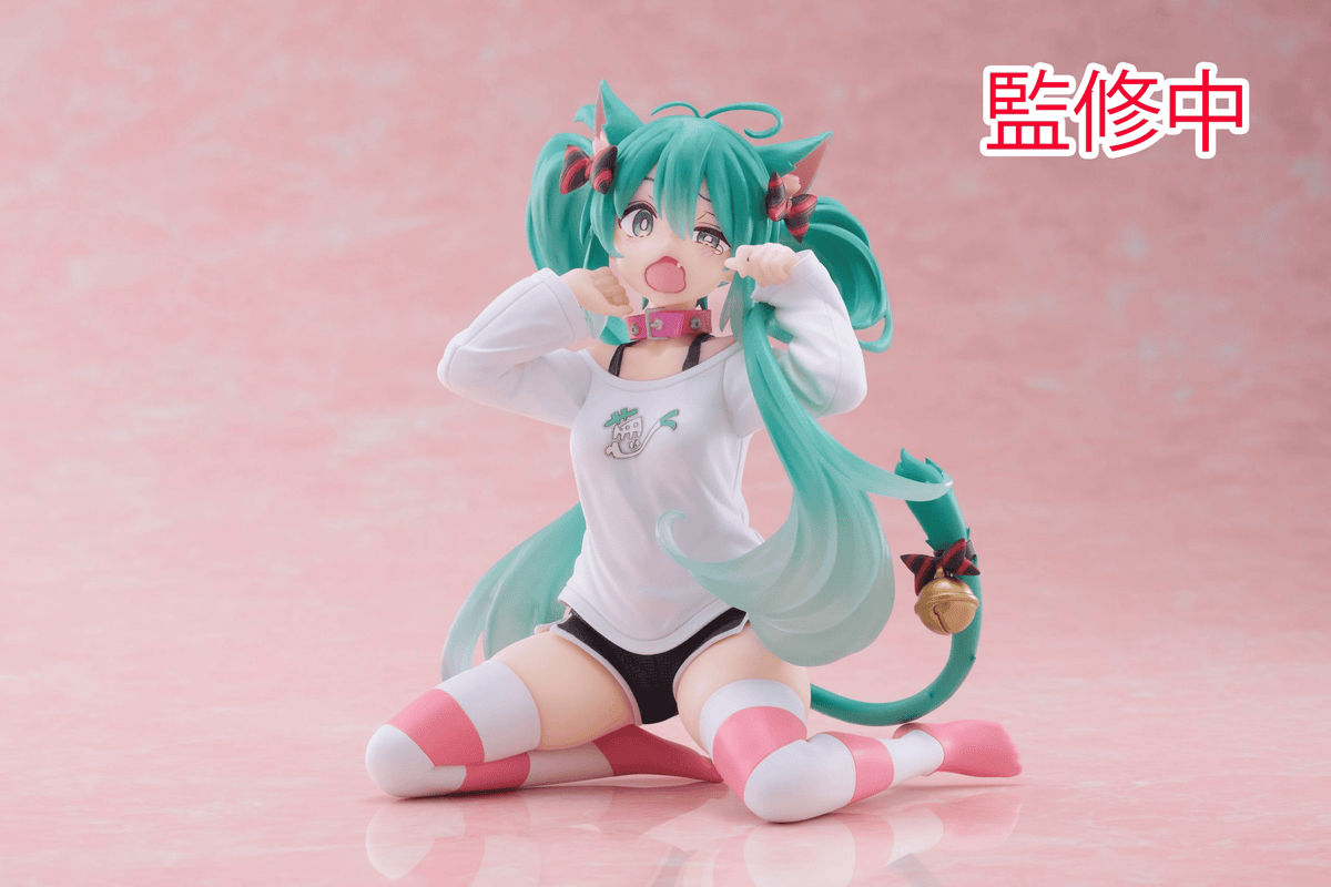A sitting figure of Hatsune Miku wearing cat ears in lounge wear. She is yawning and stretching.