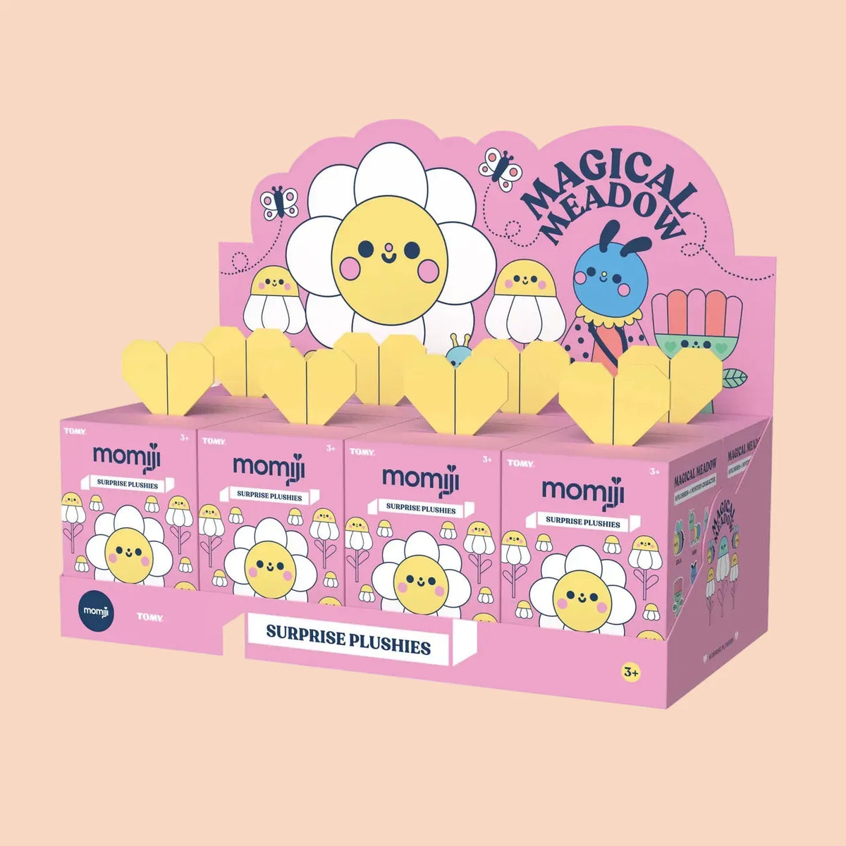 A collection of Momiji magical meadow blind boxes. The boxes are pink with cute flower illustrations on them.