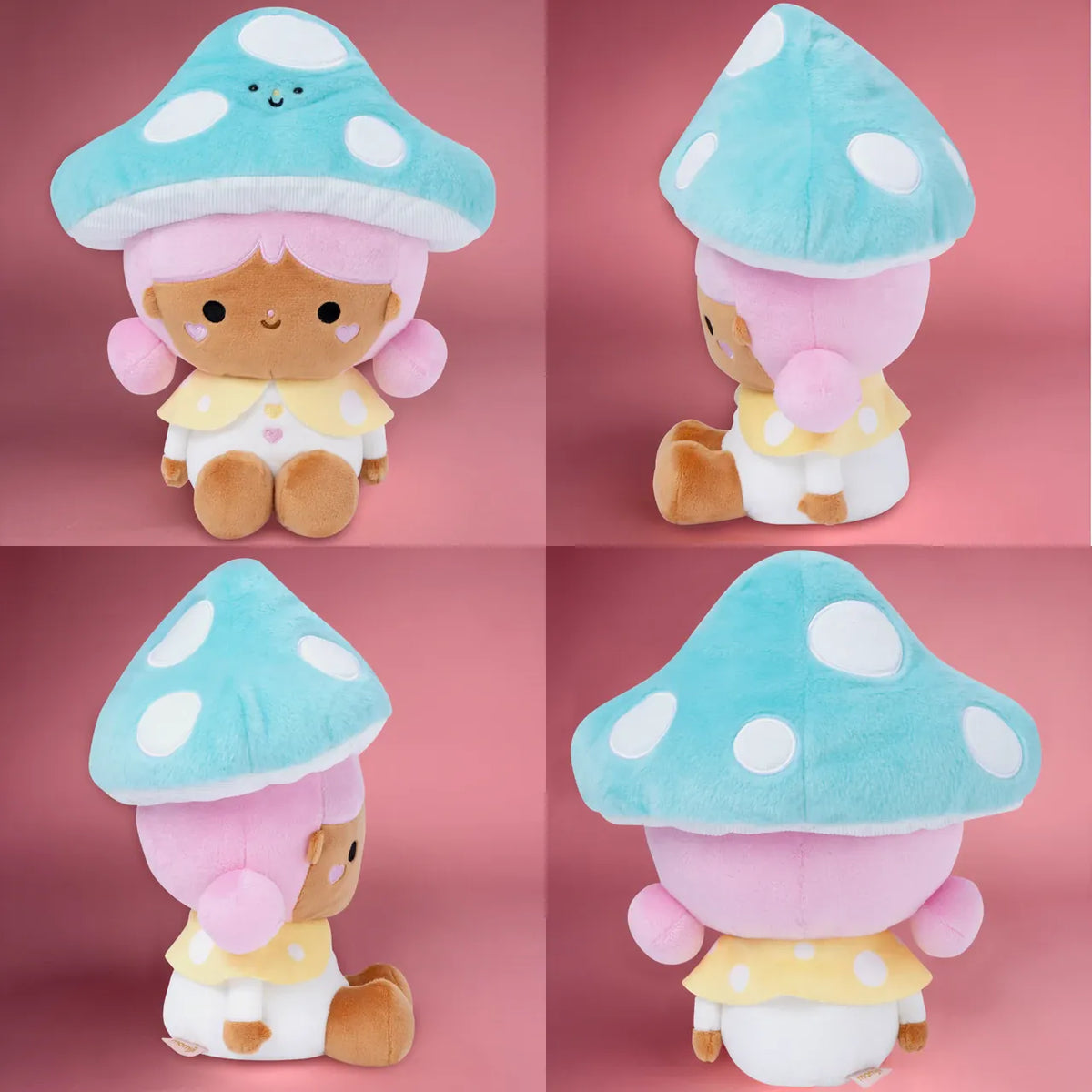 A cute plush of a girl wearing a bright blue mushroom hat. She is sitting on the floor and smiling.
