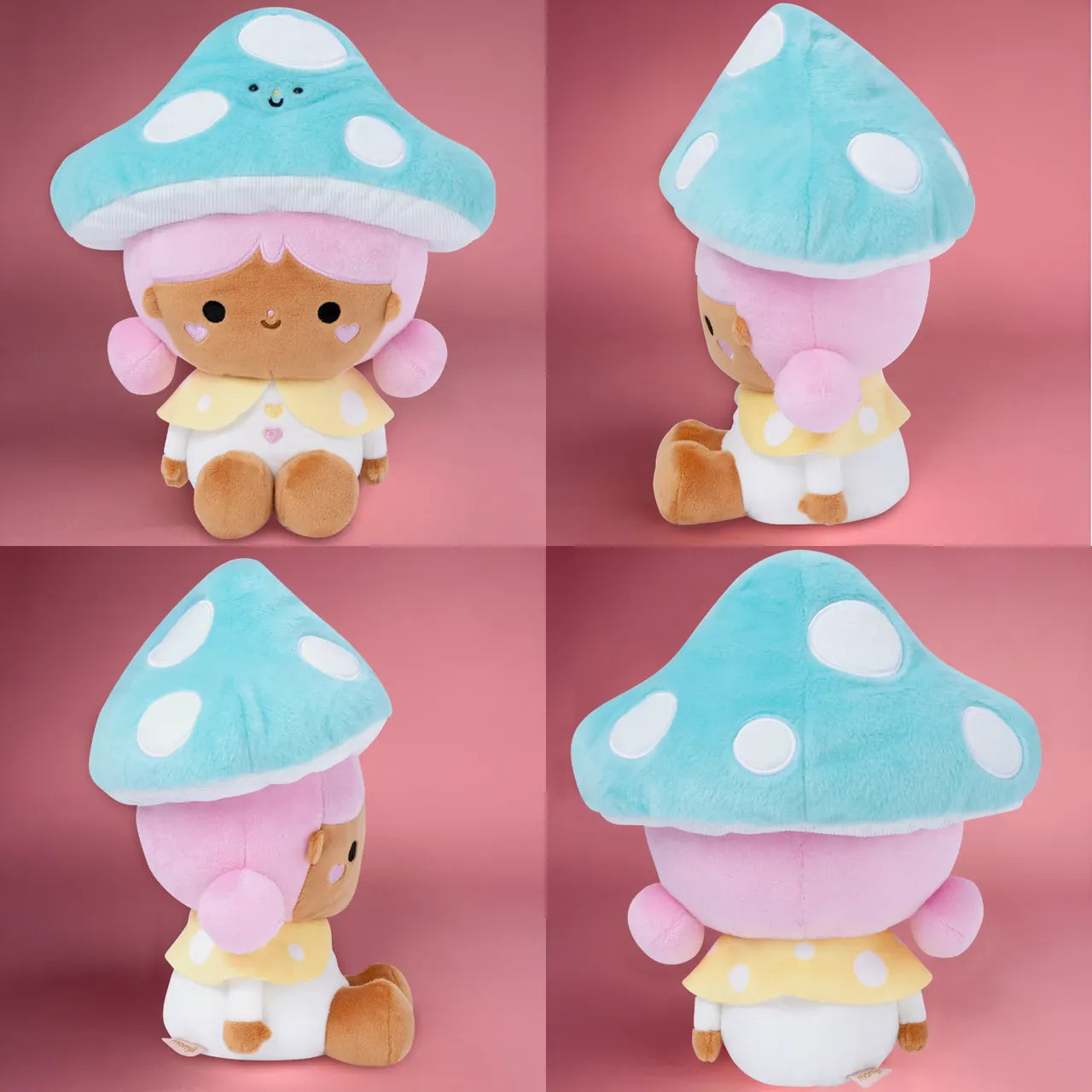 A cute plush of a girl wearing a bright blue mushroom hat. She is sitting on the floor and smiling.