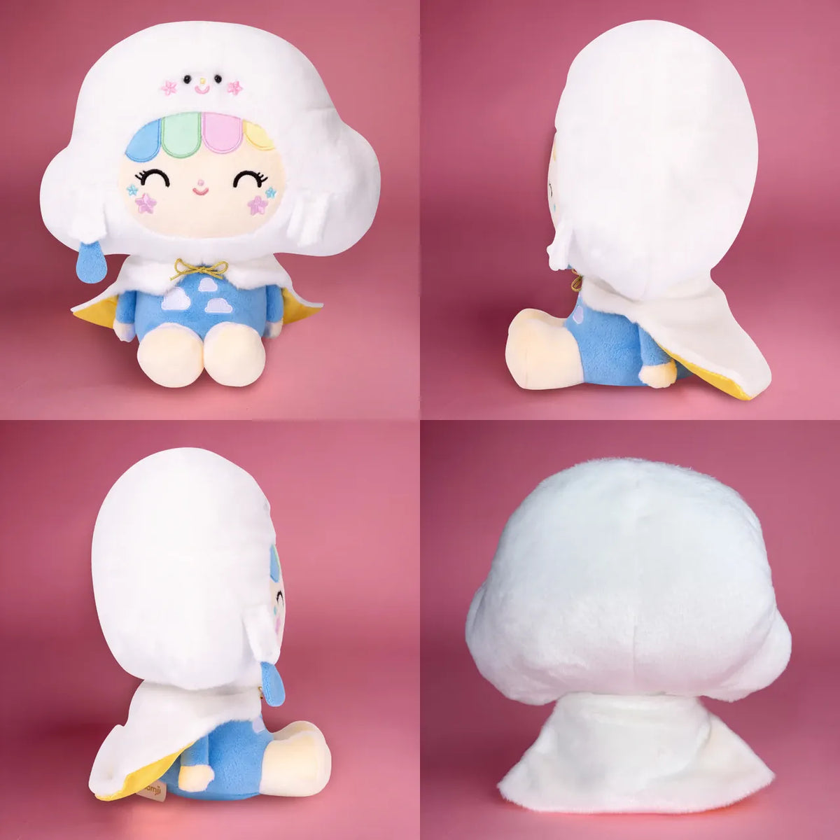 A cute plush of a girl wearing a smiling cloud hat. She is sitting on the floor and smiling.