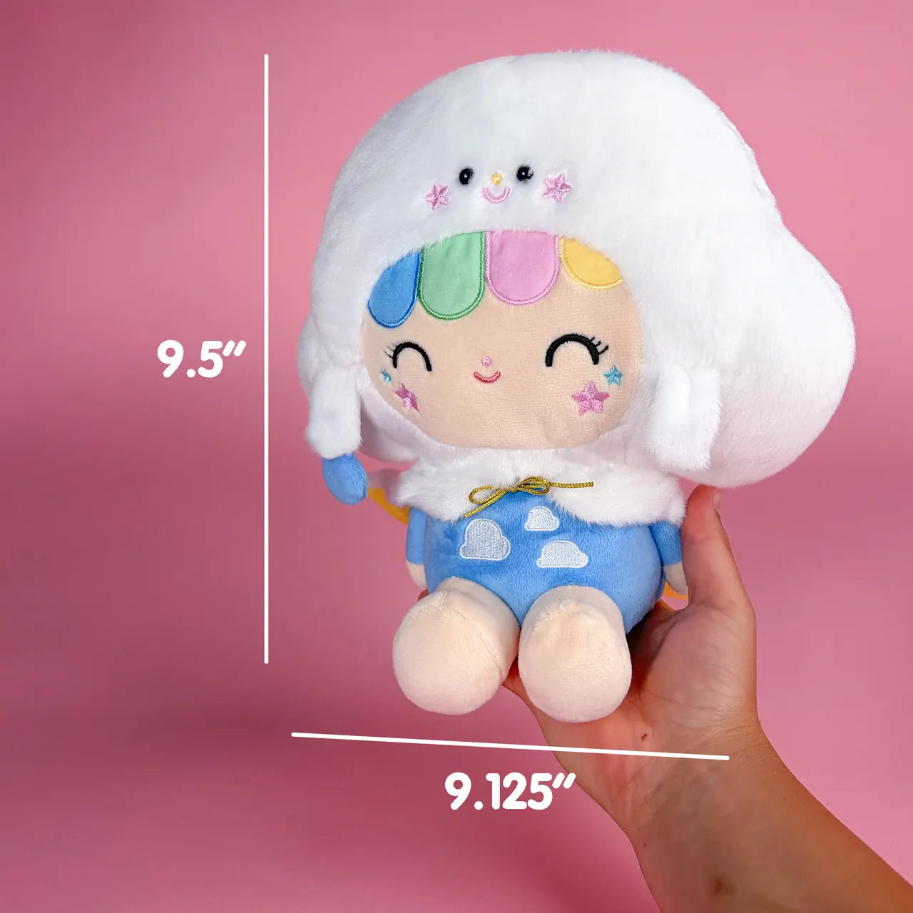 A cute plush of a girl wearing a smiling cloud hat. There are measurements showing she is 9.5 inches tall and 9.125 inches wide.