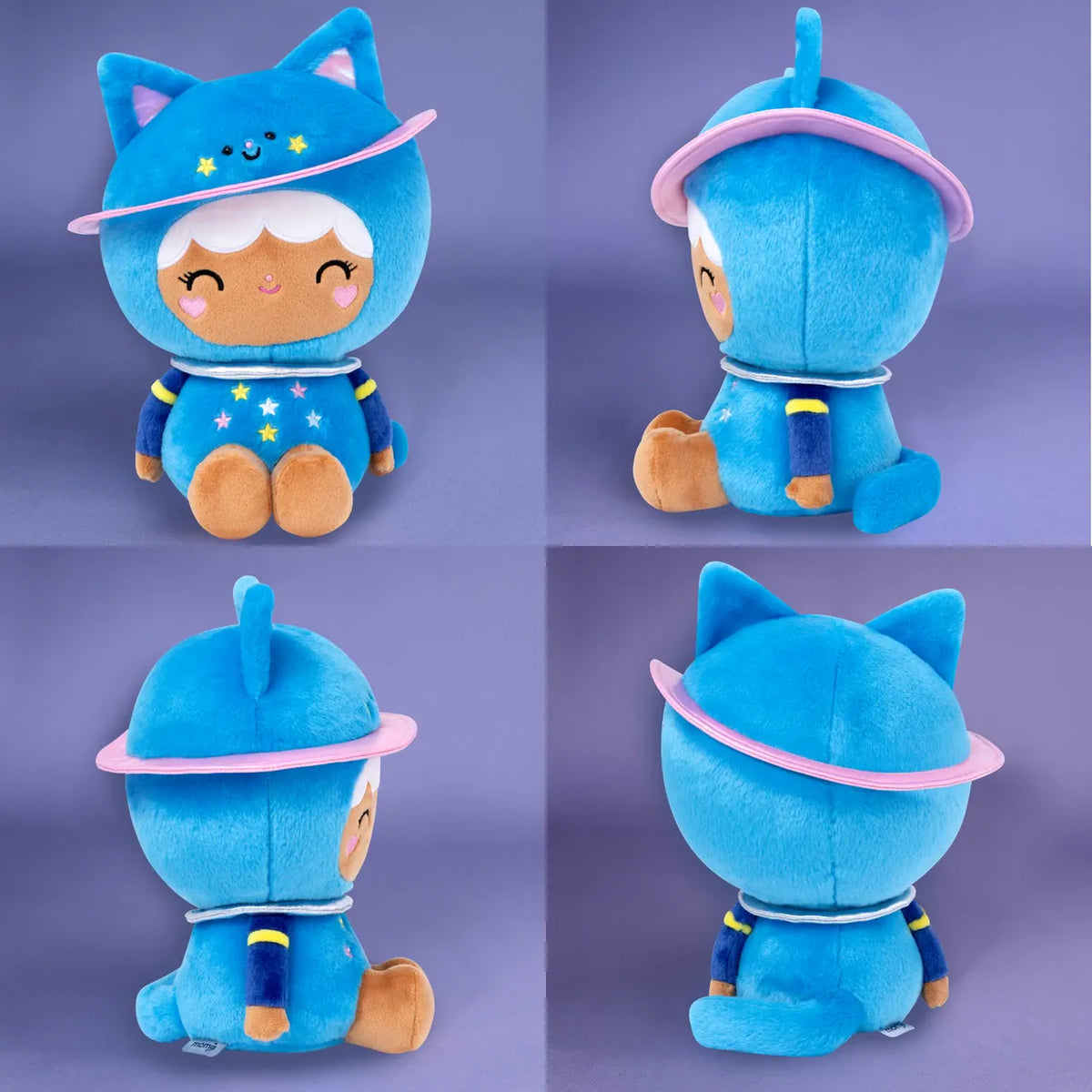A cute plush of a girl in a blue, space themed, cat onesie. She is sitting on the floor and smiling.