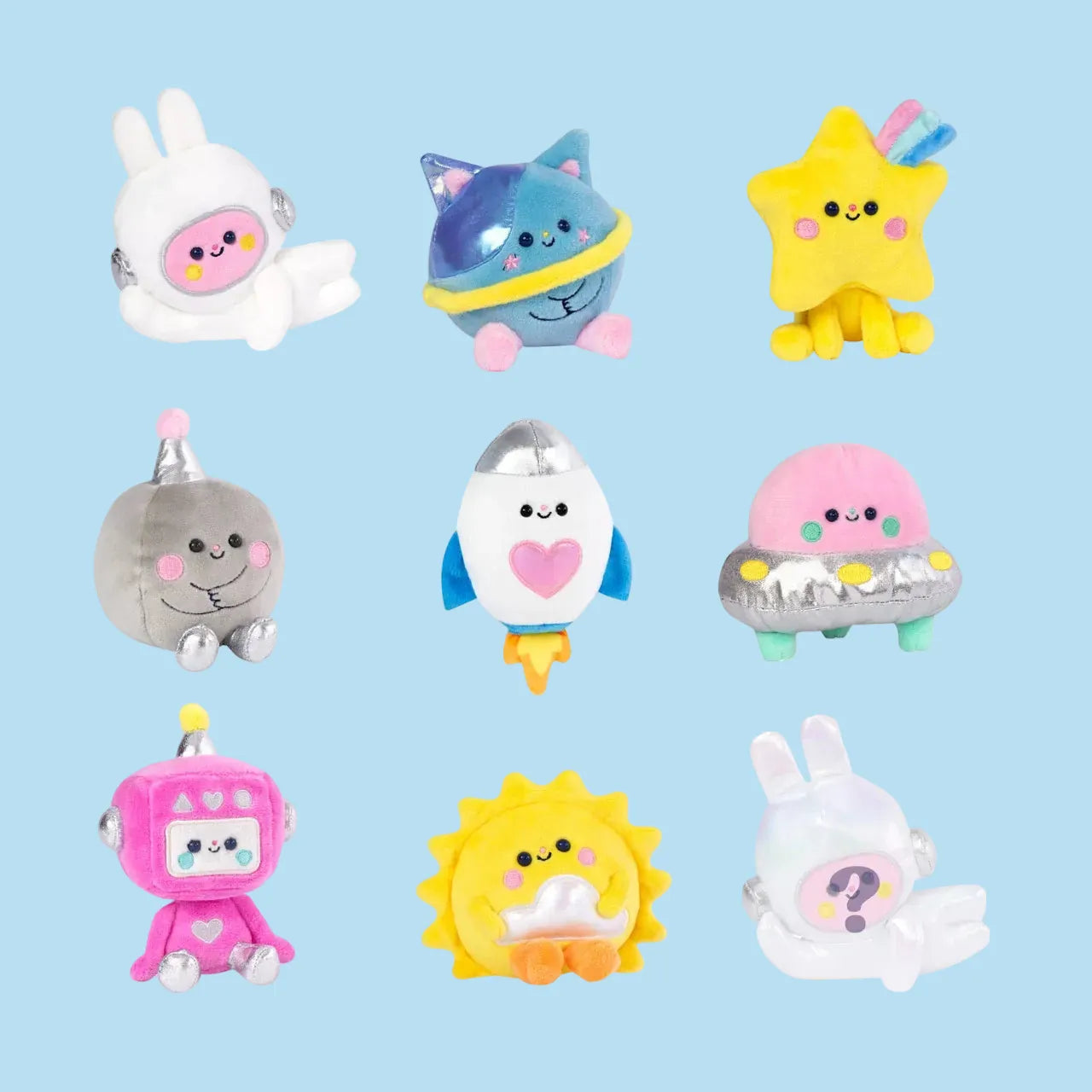 A collection of cute space themed plushies. There is a rabbit in a space suit, a smiling sun, and a happy rocket ship, as well as others.