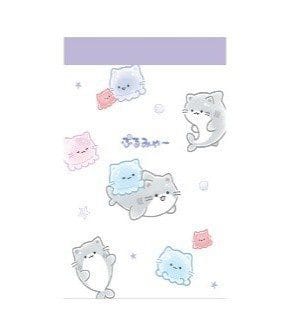 A notepad with cute illustrations of a fish cat hybrid and a jellyfish with a cat face.
