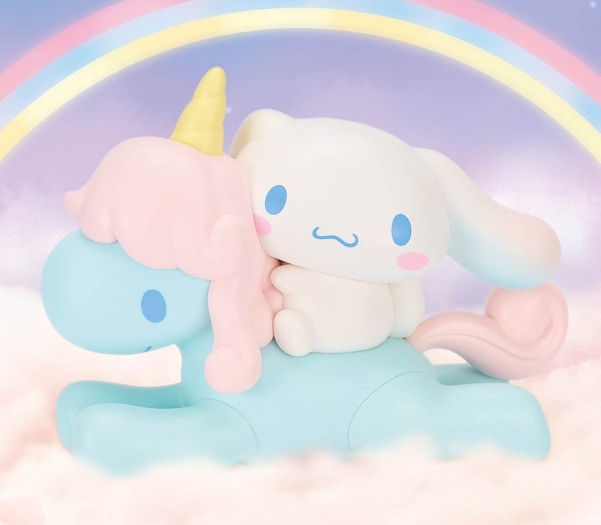 A figure of Cinnamoroll riding a blue unicorn with a pink mane.