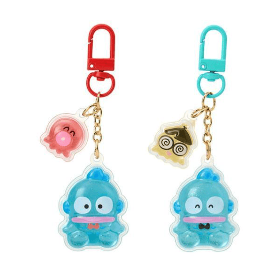 Two Hangyodon key chains. One has a squid charm attached and the other has a jellyfish charm.