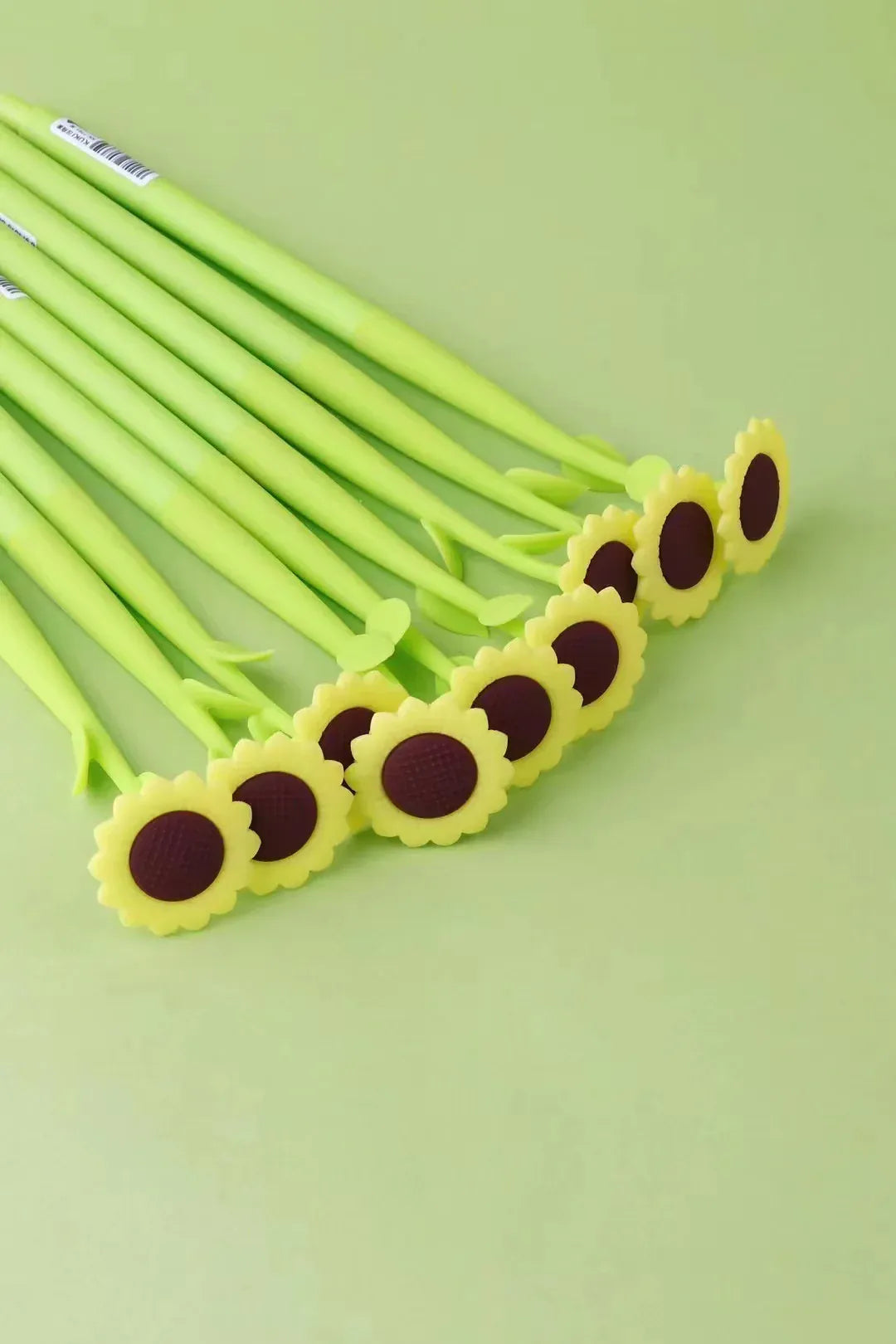 A group of pens that are designed to look like sunflowers.