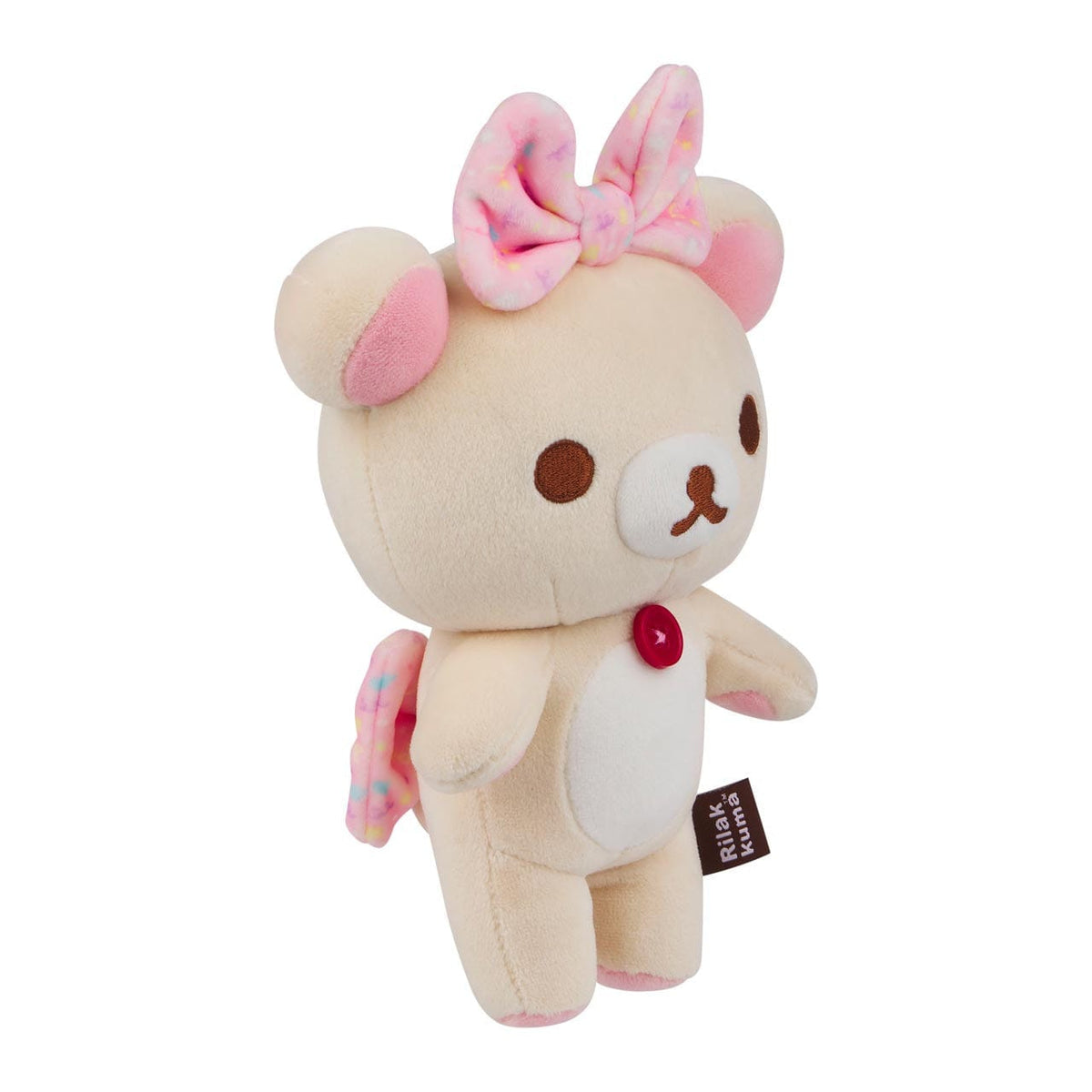 Three quarters view of a bear plushie, with a red button on its chest, and a pink bow on its head.