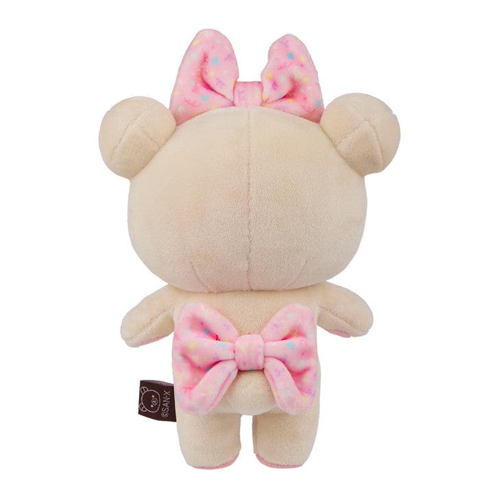 Rear view of a plushie with a pink bow on its back and a pink bow on its head.