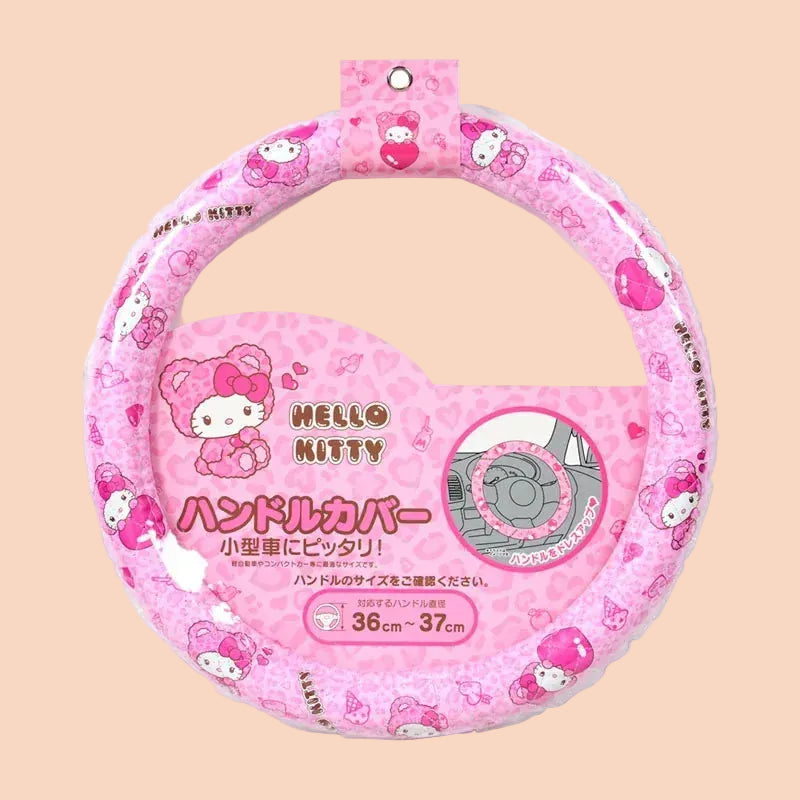 A black cover for a steering wheel with illustrations of Hello Kitty on it.