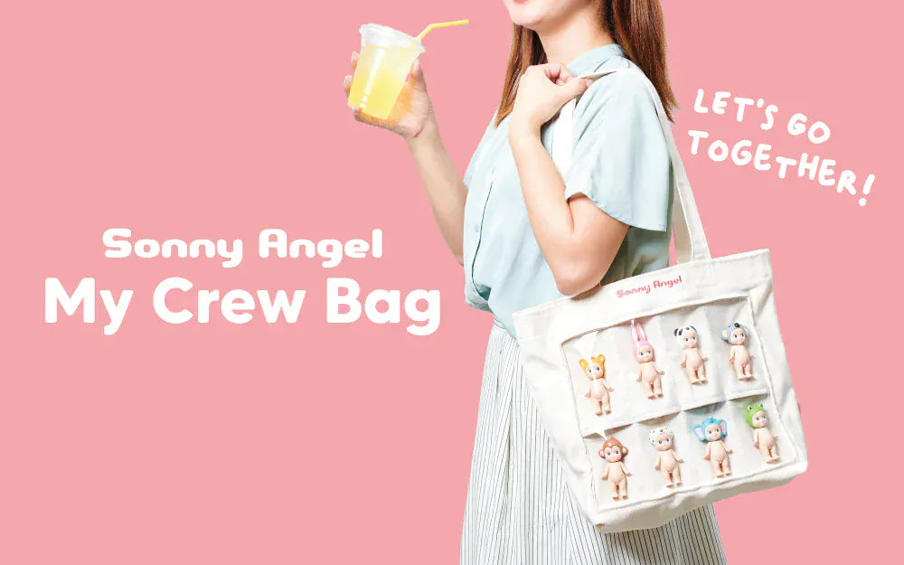 A woman wearing a tote bag which holds and displays eight Sonny Angel figures on its front side.