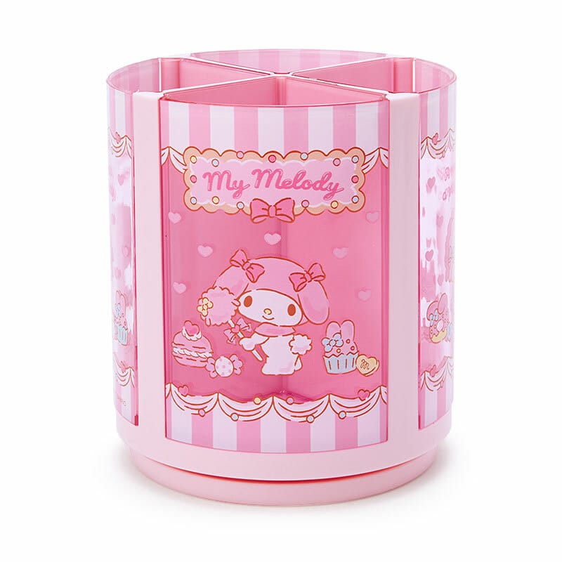 A pink pencil holder with an image of a cute rabbit character holding various sugary treats on the front. The pencil holder has text reading "My Melody".
