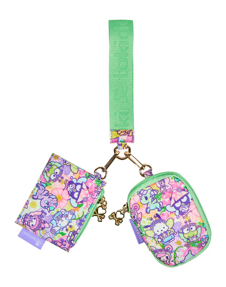 Wristlet with colorful tokidoki characters and a bright green strap.