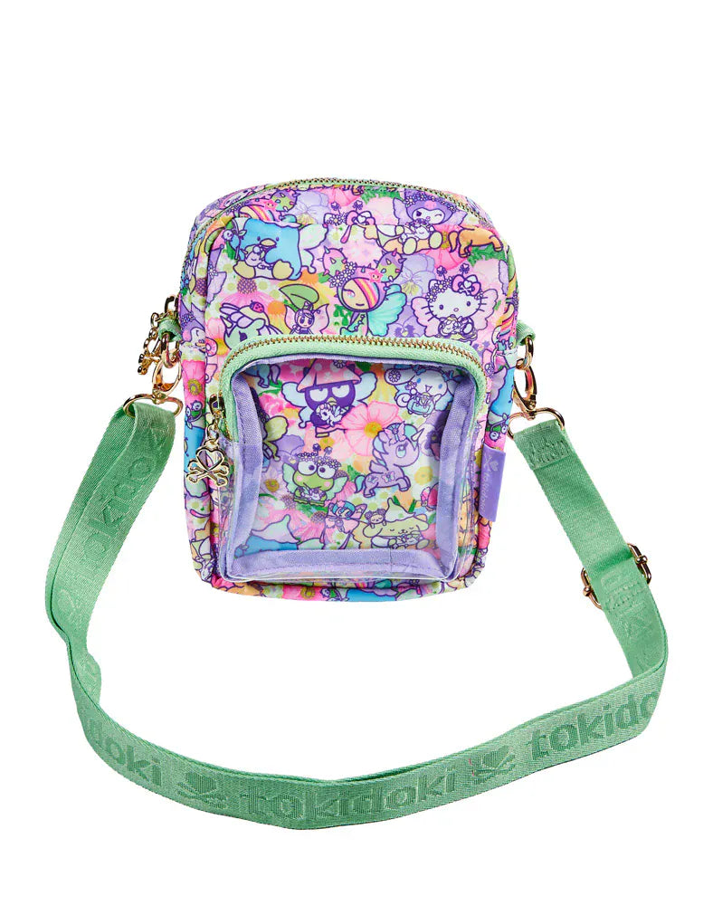 Pastel bag with Tokidoki characters and light green strap.