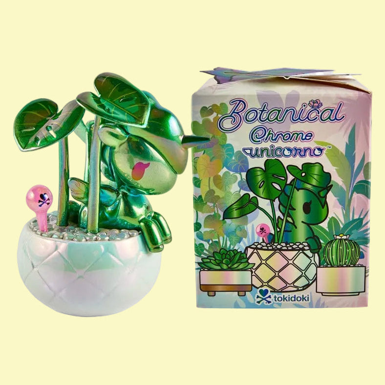 Blind box next to one of the sample figures. The figure is a potted plant with a unicorno.